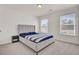 Bedroom with a large window that lets in natural light, complemented by a plush headboard at 307 Blue Oak Dr, Moncks Corner, SC 29461
