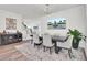 Elegant dining room featuring a modern light fixture, TV, and stylish decor at 307 Blue Oak Dr, Moncks Corner, SC 29461