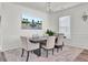 Dining room with a chandelier, large windows, and decorative wall molding at 307 Blue Oak Dr, Moncks Corner, SC 29461