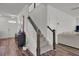 A welcoming entryway featuring a staircase, dark wooden accents, and modern flooring at 307 Blue Oak Dr, Moncks Corner, SC 29461
