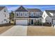 Charming two-story home with a two-car garage and meticulous landscaping at 307 Blue Oak Dr, Moncks Corner, SC 29461