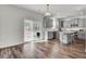 Bright kitchen with gray cabinets, granite countertops, stainless appliances, and an island with seating at 307 Blue Oak Dr, Moncks Corner, SC 29461