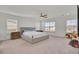 Spacious main bedroom featuring plush carpet, a ceiling fan, and plenty of natural light at 307 Blue Oak Dr, Moncks Corner, SC 29461