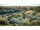 Aerial view of tennis courts, a clubhouse, and lush landscaping at 3110 Up Da Creek Ct, Seabrook Island, SC 29455