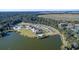 Expansive aerial view showcasing a lakeside resort with a pool, tennis courts, and surrounding natural beauty at 3110 Up Da Creek Ct, Seabrook Island, SC 29455