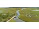 Gorgeous aerial view of marsh and tidal creek featuring community docks at 3110 Up Da Creek Ct, Seabrook Island, SC 29455