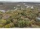 Stunning aerial view showcases the lush greenery and marsh views surrounding the property at 3110 Up Da Creek Ct, Seabrook Island, SC 29455