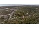 Aerial view highlighting the home's location nestled amidst mature trees and scenic waterways at 3110 Up Da Creek Ct, Seabrook Island, SC 29455