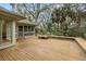 Expansive wooden deck surrounded by mature trees and lush landscaping at 3110 Up Da Creek Ct, Seabrook Island, SC 29455