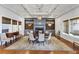 Sophisticated dining room with wood floors, fireplace, and elegant lighting at 3110 Up Da Creek Ct, Seabrook Island, SC 29455