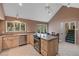 Open kitchen with vaulted ceiling, stainless appliances, and eat-in dining at 3110 Up Da Creek Ct, Seabrook Island, SC 29455