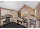 Well-lit kitchen with stainless appliances, island, and breakfast bar at 3110 Up Da Creek Ct, Seabrook Island, SC 29455