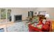 Living room with fireplace, hardwood floors, and large windows offering views of the outdoors at 3110 Up Da Creek Ct, Seabrook Island, SC 29455