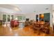 Bright living room with hardwood floors, fireplace, and ample natural light creating a cozy and inviting atmosphere at 3110 Up Da Creek Ct, Seabrook Island, SC 29455