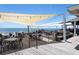 Charming outdoor dining area with overhead canvas for shade at 3110 Up Da Creek Ct, Seabrook Island, SC 29455