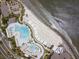 An aerial view showcasing the pool, the beach, and other community amenities at 3110 Up Da Creek Ct, Seabrook Island, SC 29455