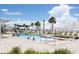 Resort-style pool area with palm trees, sun umbrellas, and lounge chairs at 3110 Up Da Creek Ct, Seabrook Island, SC 29455