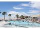 Luxurious pool deck with ample seating, palm trees, and resort-style amenities at 3110 Up Da Creek Ct, Seabrook Island, SC 29455