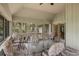 Enclosed porch featuring a dining table with chairs and forest views from all sides at 3110 Up Da Creek Ct, Seabrook Island, SC 29455