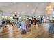 Bright shop interior featuring high ceilings, light wood floors, and a variety of clothing and accessories at 3110 Up Da Creek Ct, Seabrook Island, SC 29455