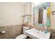 Charming bathroom with custom mirror, decorative tile, and stylish fixtures at 34 Frogmore Rd, Mount Pleasant, SC 29464