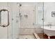 Elegant bathroom featuring glass shower and luxurious clawfoot tub on stunning hardwood floors at 34 Frogmore Rd, Mount Pleasant, SC 29464