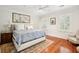 Cozy bedroom features hardwood floors and natural light, creating a relaxing atmosphere at 34 Frogmore Rd, Mount Pleasant, SC 29464