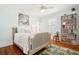 Charming bedroom with blue walls, hardwood floors, and bright natural light at 34 Frogmore Rd, Mount Pleasant, SC 29464