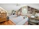 Bedroom featuring toys, built-in bookshelves, and hardwood floors at 34 Frogmore Rd, Mount Pleasant, SC 29464