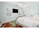 Well-lit bedroom featuring hardwood floors, a ceiling fan, and lots of bright, natural light at 34 Frogmore Rd, Mount Pleasant, SC 29464