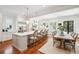 Spacious, bright, modern kitchen features a large island, stainless steel appliances and an adjacent dining area at 34 Frogmore Rd, Mount Pleasant, SC 29464