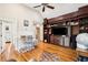 Inviting living space featuring hardwood floors, built-in shelves, and a bright workspace with comfortable seating at 34 Frogmore Rd, Mount Pleasant, SC 29464
