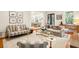 Elegant living room showcasing an open layout with seamless flow to dining area at 34 Frogmore Rd, Mount Pleasant, SC 29464