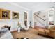 Inviting living room featuring hardwood floors, elegant décor, and an open layout leading to other living areas at 34 Frogmore Rd, Mount Pleasant, SC 29464