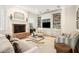 Bright living room with fireplace, custom built-ins, and comfortable seating arrangement at 34 Frogmore Rd, Mount Pleasant, SC 29464