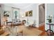 Cozy living room with hardwood floors, stylish furnishings, natural light, and elegant wainscoting details at 34 Frogmore Rd, Mount Pleasant, SC 29464