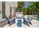 Inviting outdoor patio featuring comfortable seating, a grill, and serene views of the backyard pool area at 34 Frogmore Rd, Mount Pleasant, SC 29464