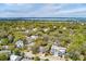 Aerial view of a residential area near the water with homes nestled among lush greenery and mature trees at 3405 Cameron Blvd, Isle of Palms, SC 29451