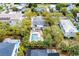 Aerial shot of a home featuring a backyard pool, patio area, mature trees, and a well-maintained yard at 3405 Cameron Blvd, Isle of Palms, SC 29451