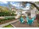 Inviting backyard with a fire pit surrounded by Adirondack chairs and a beautiful pool at 3405 Cameron Blvd, Isle of Palms, SC 29451