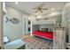 Stylish bedroom features a bunk bed, ceiling fan, laundry, and charming decor at 3405 Cameron Blvd, Isle of Palms, SC 29451