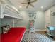 Bedroom features a bunk bed, ceiling fan, whimsical decor, and a bright, airy ambiance at 3405 Cameron Blvd, Isle of Palms, SC 29451