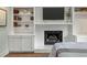 Comfortable bedroom with a white-painted brick fireplace and built-in bookshelves at 3405 Cameron Blvd, Isle of Palms, SC 29451