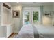 Bright bedroom featuring French doors to the outdoor seating area, plus built-in storage at 3405 Cameron Blvd, Isle of Palms, SC 29451