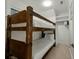 Cozy bunk room features sturdy wooden bunk beds and ample lighting at 3405 Cameron Blvd, Isle of Palms, SC 29451