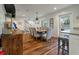 Bright dining area with wood floors, shiplap walls, and seating for eight at 3405 Cameron Blvd, Isle of Palms, SC 29451