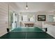 Spacious game room with ping pong table, recessed lighting, and access to the outdoors at 3405 Cameron Blvd, Isle of Palms, SC 29451