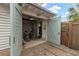 Garage area with open doors, bikes, and storage, showcasing a convenient space for hobbies and outdoor gear at 3405 Cameron Blvd, Isle of Palms, SC 29451