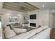 Bright living room boasts shiplap walls, a fireplace, and comfortable seating for entertaining guests at 3405 Cameron Blvd, Isle of Palms, SC 29451