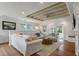 Spacious living room featuring shiplap walls, wooden ceiling beams, and comfortable seating at 3405 Cameron Blvd, Isle of Palms, SC 29451